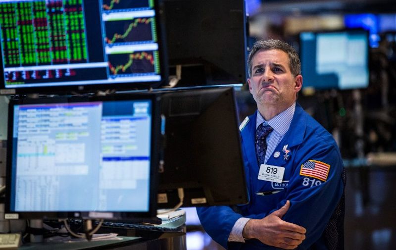 NEW YORK, NY &#8211; APRIL 15: A trader works on the floor of the New York Stock Exchange during the afternoon of April 15, 2015 in New York City. The Dow Jones Industrial Average closed 75 points higher today. Andrew Burton/Getty Images/AFP