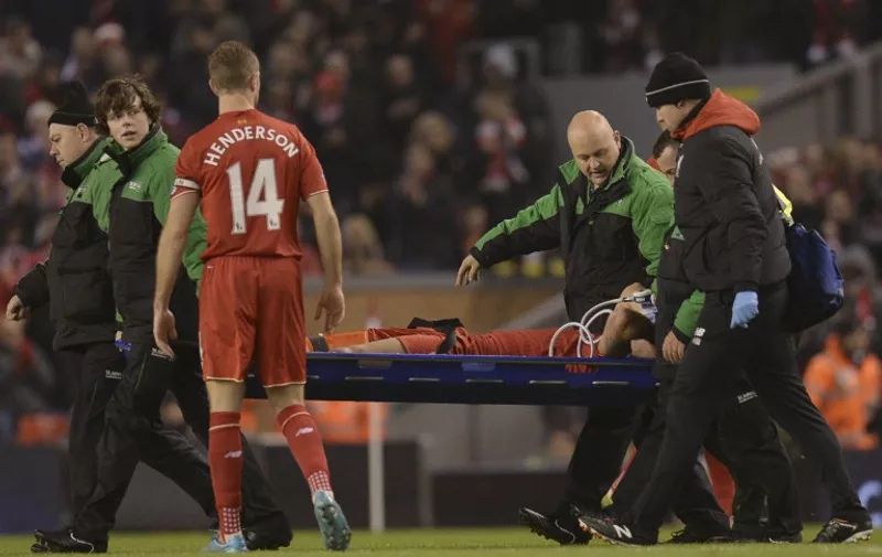 Liverpool's Croatian defender Dejan Lovren (C) is stretchered off after being injured in a challenge with West Bromwich Albion's English midfielder Craig Gardner during the English Premier League football match between Liverpool and West Bromwich Albion at Anfield in Liverpool, northwest England, on December 13, 2015.  AFP PHOTO / OLI SCARFF

RESTRICTED TO EDITORIAL USE. No use with unauthorized audio, video, data, fixture lists, club/league logos or 'live' services. Online in-match use limited to 75 images, no video emulation. No use in betting, games or single club/league/player publications. / AFP / OLI SCARFF