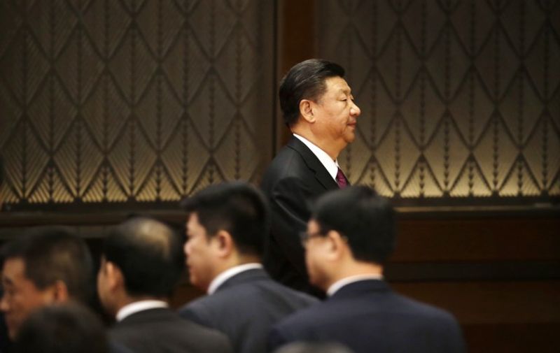 Chinese President Xi Jinping leaves after a news conference at the Belt and Road Forum, at the International Conference Center in Yanqi Lake, north of Beijing, on May 15, 2017. 
Chinese President Xi Jinping urged world leaders to reject protectionism on May 15 at a summit positioning Beijing as a champion of globalisation, as some countries raised concerns over his trade ambitions. / AFP PHOTO / POOL / JASON LEE