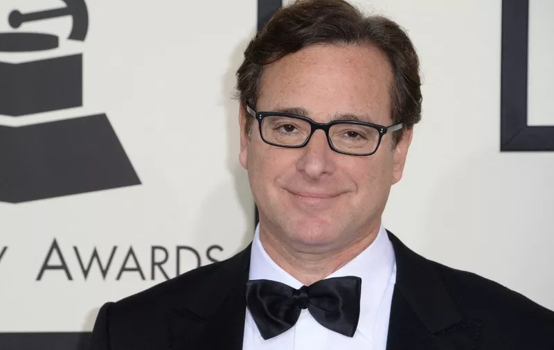 (FILES) In this file photo taken on January 26, 2014 Bob Saget arrives on the red carpet for the 56th Grammy Awards at the Staples Center in Los Angeles, California. - Bob Saget, the US comedian who delighted millions as the star of television's "Full House" in the 1980s and 1990s, has been found dead in a Florida hotel room, the local sheriff said on January 9, 2022. (Photo by Robyn BECK / AFP)