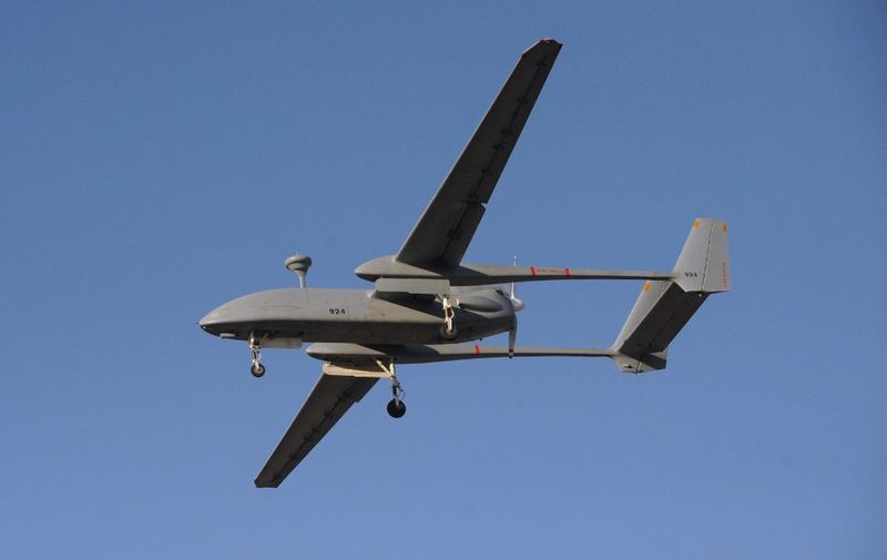 An Indian Navy "Heron", an Israeli-made unmanned aerial vehicle (UAV,) flies over the Porbandar airfield in Porbandar, some 400 kms from Ahmedabad, on January 17, 2011. The Indian Navy's UAV Squadron INAS 343 namely Heron and Searcher MK II were commissioned by the governor of India's Gujarat state Shrimati Kamla on January 17. AFP PHOTO / Sam PANTHAKY (Photo by SAM PANTHAKY / AFP)