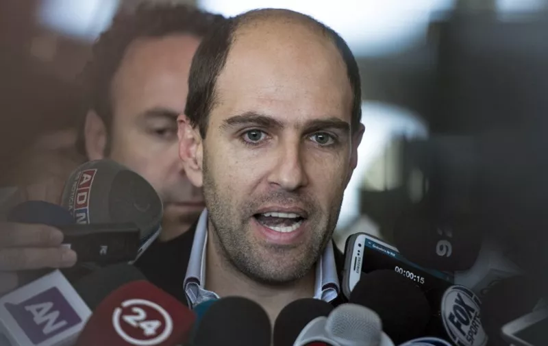 Sergio Jadue, President of the Chilean Football Association and CONMEBOL Vice president speaks with the press upon his arrival in Santiago on November 12, 2015.    