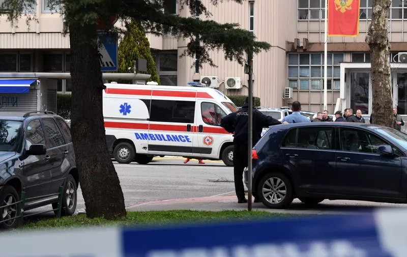 An ambulance is stationed outside the entrance to Podgorica County Court, on March 3, 2023. A suicide bomber detonated an explosive device inside the courthouse on March 3, killing himself and injuring eight people, two of whom sustained life threatening injuries. The incident happened at Montenegro's Basic Court, a lower judiciary body that handles municipal cases in the capital. (Photo by SAVO PRELEVIC / AFP)