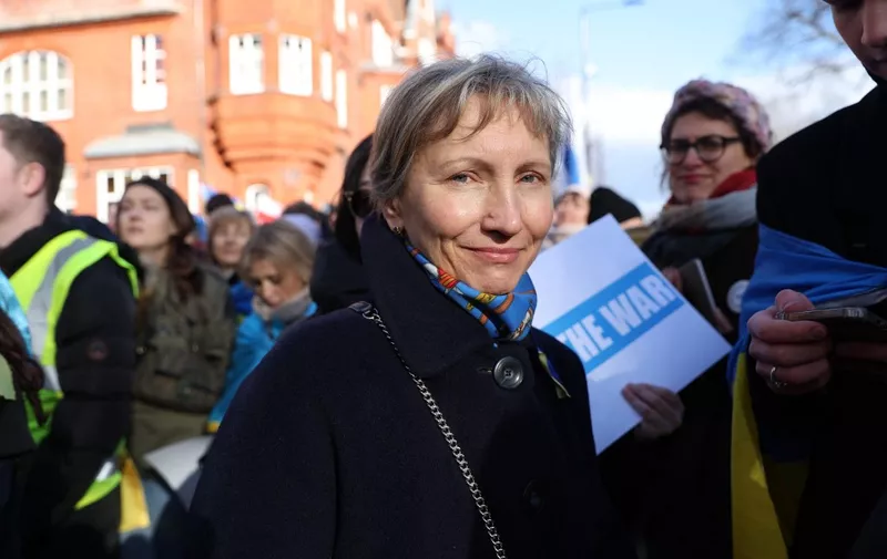 Marina Litvinenko, widow of murdered Russian ex-spy Alexander Litvinenk, with protesters including Russian citizens living in the UK outside the Russian Embassy after they marched through central London to show solidarity with Ukraine on February 25, 2023, following Friday's first anniversary of Russia's invasion of Ukraine. February 24 marked the first anniversary of Russia's invasion of Ukraine, as Ukrainians braced for possible new Russian strikes after a year of defiance and grief. Russia's President stunned the world by sending troops across the border in the early hours of the morning of February 24, 2022, to "de-militarise" Ukraine, in a move seen as punishment for Kyiv's pivot to the West. (Photo by ISABEL INFANTES / AFP)