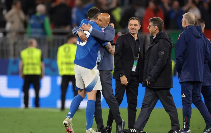 Dortmund, Germany, 15th June 2024. Luciano Spalletti Head coach of Italy embraces Alessandro Bastoni of Italy following the final whistle of the UEFA European Championships match at BVB Stadion, Dortmund. Picture credit should read: Jonathan Moscrop / Sportimage EDITORIAL USE ONLY. No use with unauthorised audio, video, data, fixture lists, club/league logos or live services. Online in-match use limited to 120 images, no video emulation. No use in betting, games or single club/league/player publications. SPI-3182-0027