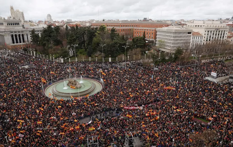 Protestors wave Spanish national flags next to Cibeles Fountain during a demonstration called by Foro Libertad y Alternativa (Freedom &amp; Alternative forum) with other several unionist associations against the government's amnesty law for people involved in Catalonia's failed 2017 independence bid, in Cibeles square in Madrid, on March 9, 2024. Spain's ruling Socialists and Catalan independence parties said on March 6, 2024 that they had agreed on a new amnesty law bill that has polarised the country. (Photo by Pierre-Philippe MARCOU / AFP)