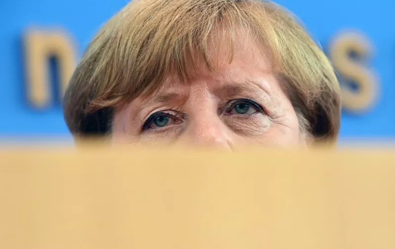 German Chancellor Angela Merkel addresses a press conference in Berlin on August 31, 2015. AFP PHOTO / JOHN MACDOUGALL