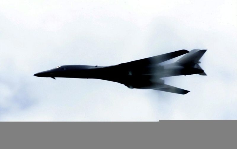 This image obtained from the US Air Force 01 November, 2001 shows a B-1B Lancer performing a low-level fly-by for troops deployed for Operation Enduring Freedom on 27 October over an unidentified location. The B-1B's three internal weapons bays can accommodate up to 84 Mk-82 general purpose bombs or Mk-62 naval mines, 30 CBU-87/89 cluster munitions or CBU-97 Sensor Fused Weapons. AFP PHOTO/ USAF/ Rebeca M. Luquin / AFP PHOTO / US AIR FORCE / REBECA M. LUQUIN