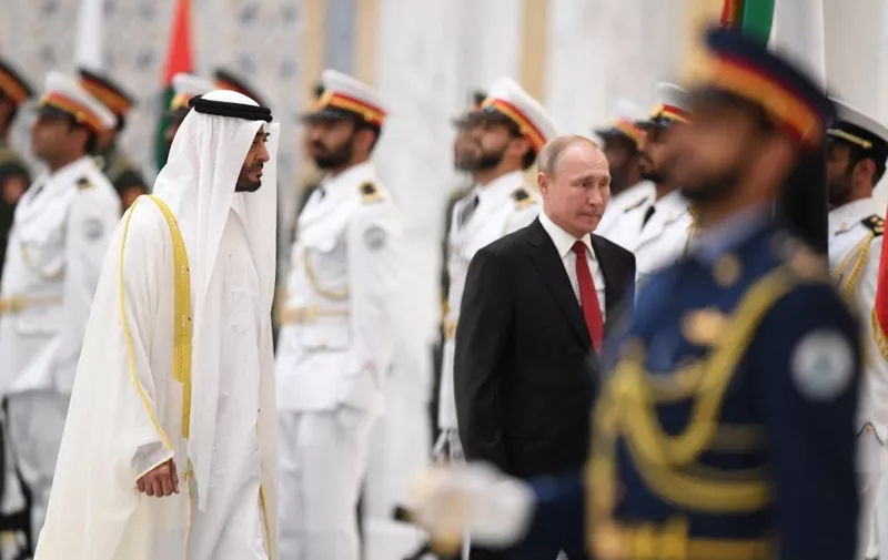 Russian President Vladimir Putin (R) is received by Sheikh Mohamed bin Zayed al-Nahyan, Crown Prince of Abu Dhabi, during an official welcoming in the Emirati capital's Al-Watan presidential palace on October 15, 2019. (Photo by KARIM SAHIB / AFP)