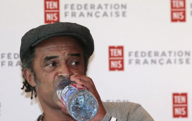 Former tennis player Yannick Noah, recently nominated captain of the French Davis Cup team by French Tennis Federation, addresses a press conference at Rolland Garros on September 22, 2015 in Paris.      AFP PHOTO/JACQUES DEMARTHON / AFP / JACQUES DEMARTHON