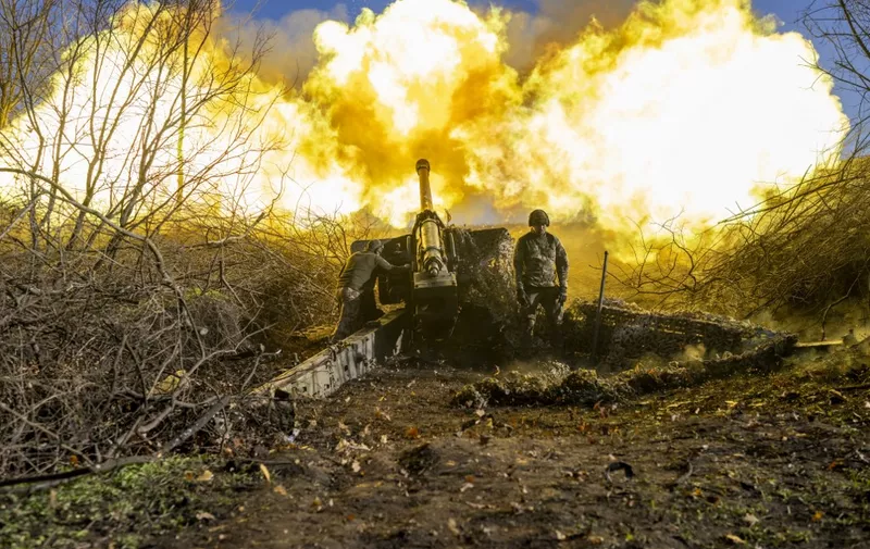 A Ukrainian soldier of an artillery unit fires towards Russian positions outside Bakhmut on November 8, 2022, amid the Russian invasion of Ukraine. (Photo by BULENT KILIC / AFP)
