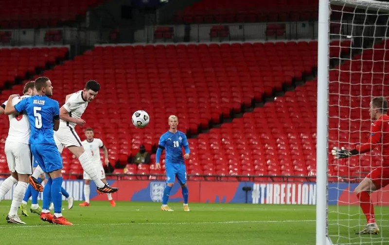 England's defender Declan Rice (3R) scores the opening goal during the UEFA Nations League group A2 football match between England and Iceland at Wembley stadium in north London on November 18, 2020. (Photo by CARL RECINE / POOL / AFP) / NOT FOR MARKETING OR ADVERTISING USE / RESTRICTED TO EDITORIAL USE