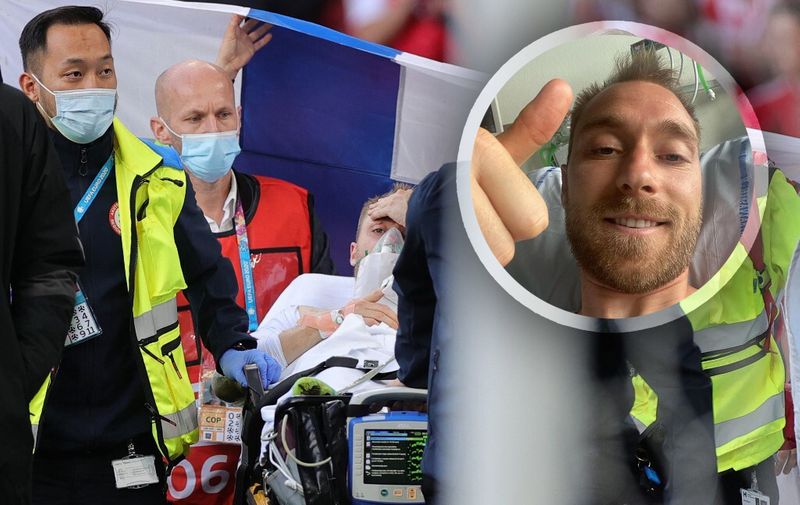 Denmark's midfielder Christian Eriksen (C) is evacuated after collapsing on the pitch during the UEFA EURO 2020 Group B football match between Denmark and Finland at the Parken Stadium in Copenhagen on June 12, 2021. (Photo by Friedemann Vogel / various sources / AFP)