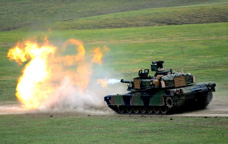 A US M1A2 Abrams tank fires during the Noble Partner 2016 joint military exercise at the Vaziani training area outside Tbilisi on May 18, 2016. - Some 500 Georgian, 650 US and 150 British troops are taking part in the drills, billed as the largest ever to be held in the Caucasus nation, which fought a brief war with Russia in 2008. (Photo by Vano Shlamov / AFP)