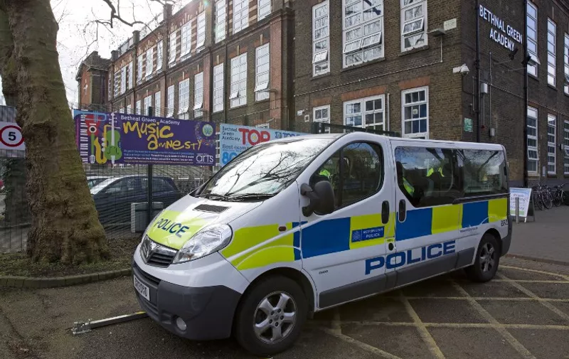 A police vehicle is pictured outside Bethnal Green Academy, where three missing British school girls attend, in east London, on February 23, 2015. Britain debated Sunday how to stop teenage girls joining the Islamic State group in Syria after three high-achieving youngsters became the latest to run away from home.  AFP PHOTO / JUSTIN TALLIS