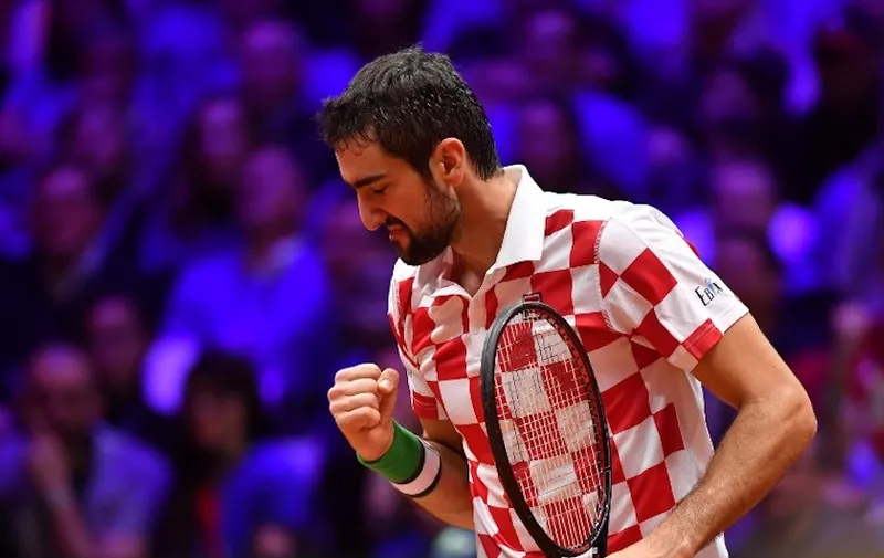 Croatian player Marin Cilic reacts during the single tennis match against French Lucas Pouille as part of the Davis Cup final between France and Croatia, on November 25, 2018 in Lille, northern France. (Photo by PHILIPPE HUGUEN / AFP)