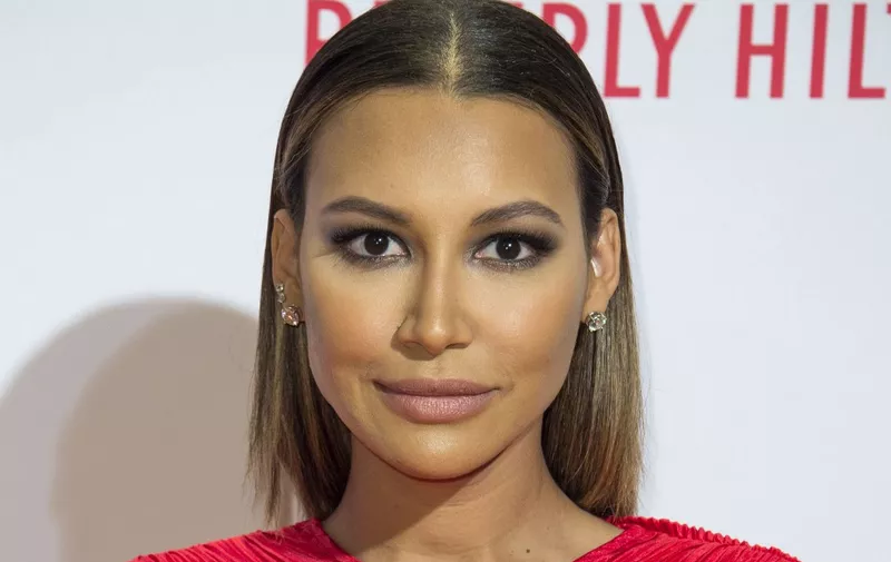 (FILES) This file photo taken on April 15, 2016 shows actress Naya Rivera posing as she attends the 23rd Annual Race To Erase MS Gala in Beverly Hills, California. - "Glee" star Naya Rivera is missing and feared drowned at a California lake, local officials said, with rescuers to continue a search for her on July 9, 2020. (Photo by VALERIE MACON / AFP)