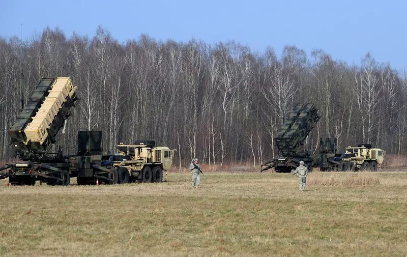 (FILES) This picture taken on March 21, 2015 shows US troops from the 5th Battalion of the 7th Air Defense Regiment emplace a launching station of the Patriot air and missile defence system at a test range in Sochaczew, Poland, as part of a joint exercise with Polands troops of the 37th Missile Squadron of Air Defense that is to demonstrate the US Armys capacity to deploy Patriot systems rapidly within NATO territory. Russia's 2014 annexation of Crimea and its subsequent meddling in eastern Ukraine have triggered vigilance in nearby Poland, the Baltic states and Scandinavia.     AFP PHOTO / JANEK SKARZYNSKI (Photo by JANEK SKARZYNSKI / AFP)