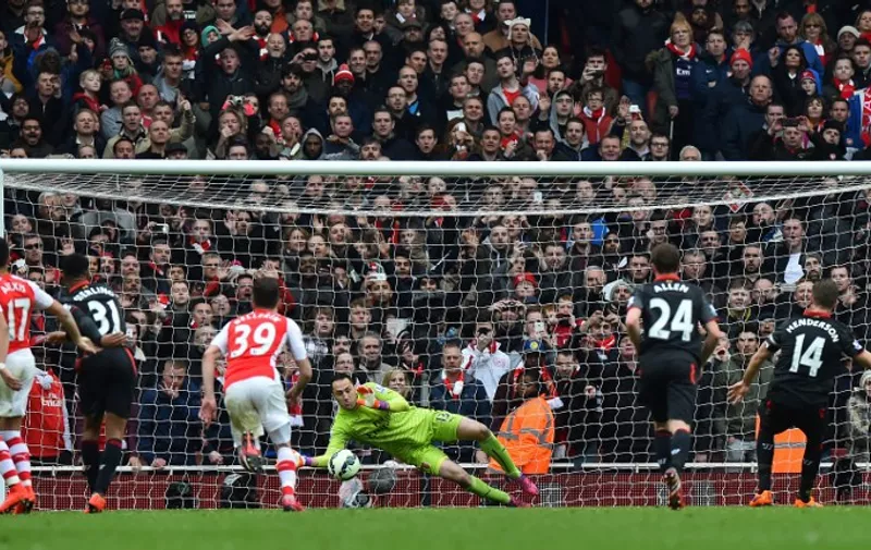 Liverpool&#8217;s English midfielder Jordan Henderson (R) scores from the penalty spot past Arsenal&#8217;s Colombian goalkeeper David Ospina (C) during the English Premier League football match between Arsenal and Liverpool at the Emirates Stadium in London on April 4, 2015. AFP PHOTO / RESTRICTED TO EDITORIAL USE. NO USE WITH UNAUTHORIZED AUDIO, VIDEO, DATA, FIXTURE LISTS, [&hellip;]