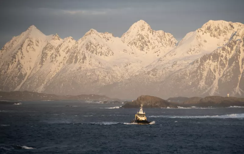 Fishermen boats sail out of Svolvaer harbour in Lofoten Islands, on March 2, 2024. (Photo by Olivier MORIN / AFP)