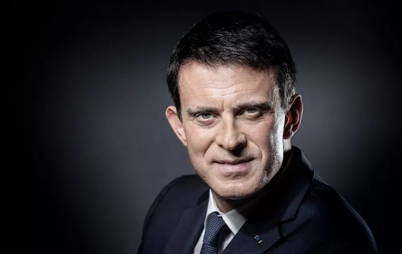 (FILES) This file photo taken on November 24, 2016 shows French Prime Minister Manuel Valls posing during a photo session in his office at the Hotel de Matignon in Paris.
French Prime Minister Manuel Valls announced on December 5, 2016 he is running to become the Socialist presidential candidate for the 2017 Presidential elections. / AFP PHOTO / JOEL SAGET