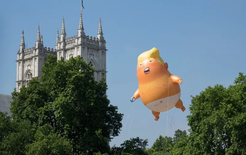 A giant inflatable balloon depicting President Trump as a baby in a nappy is flown over Parliament Square. President Trump is on the second day of a four day visit to the UK.
Trump Baby Blimp takes flight, Parliament Square London, UK - 13 Jul 2018, Image: 377709274, License: Rights-managed, Restrictions: , Model Release: no, Credit line: Profimedia, TEMP Rex Features