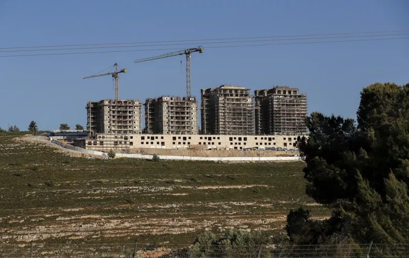This picture taken on May 10, 2022 shows a view of construction work in the Jewish settlement of Givat Zeev, between Jerusalem and Ramallah, in the Israeli-occupied West Bank. (Photo by AHMAD GHARABLI / AFP)