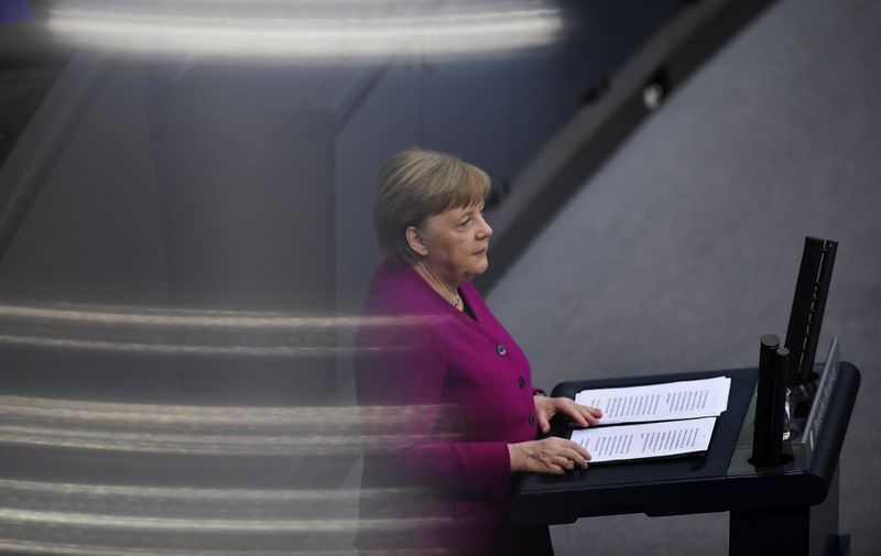 German Chancellor Angela Merkel delivers a speech about the measures in the coronavirus pandemic at the German Bundestag (lower house of parliament) in Berlin on April 23, 2020. (Photo by Tobias SCHWARZ / AFP)
