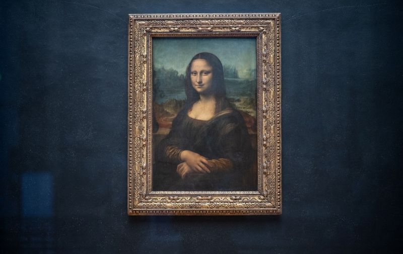 (FILES) The portrait of Lisa Gherardini, wife of Francesco del Giocondo, known as the Mona Lisa or La Gioconda (La Joconde in French), painted by Italian artsist Leonardo da Vinci, is displayed in the "Salle des Etats" of the Louvre Museum in Paris, on January 8, 2021. The protection glass covering The Mona Lisa or La Gioconda (La Joconde in French) has been splashed with soupe by environmental activists on January 28, 2024. (Photo by Martin BUREAU / AFP)