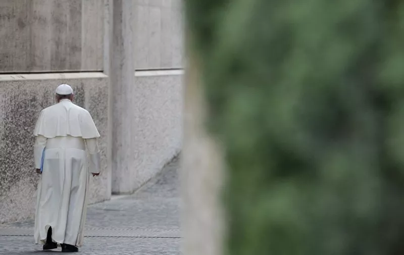Pope Francis leaves after the opening of the 68th General Assembly of the Italian Episcopal Conference on May 18, 2015 at the Vatican.   AFP PHOTO / ANDREAS SOLARO