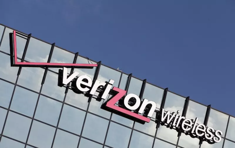 Corporate logo of Verizon wireless on the mirrored-glass of an office building, in April 2013.