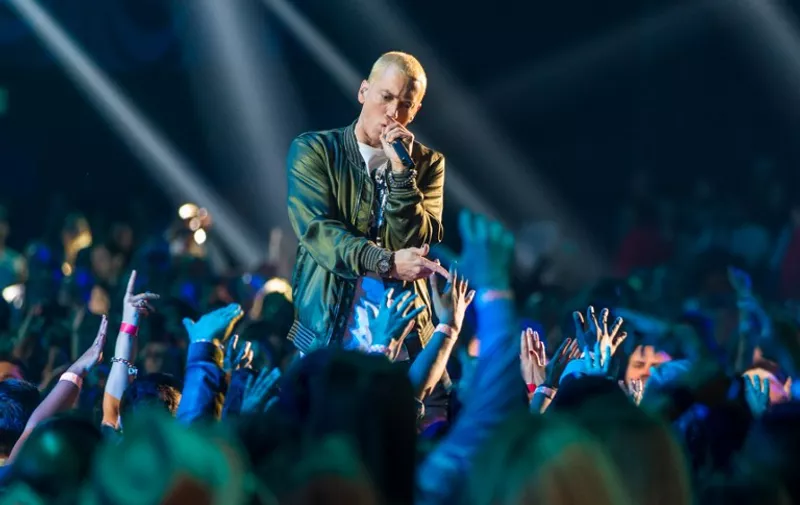 LOS ANGELES, CA - APRIL 13: Recording artists Eminem performs onstage at the 2014 MTV Movie Awards at Nokia Theatre L.A. Live on April 13, 2014 in Los Angeles, California.   Christopher Polk/Getty Images for MTV/AFP