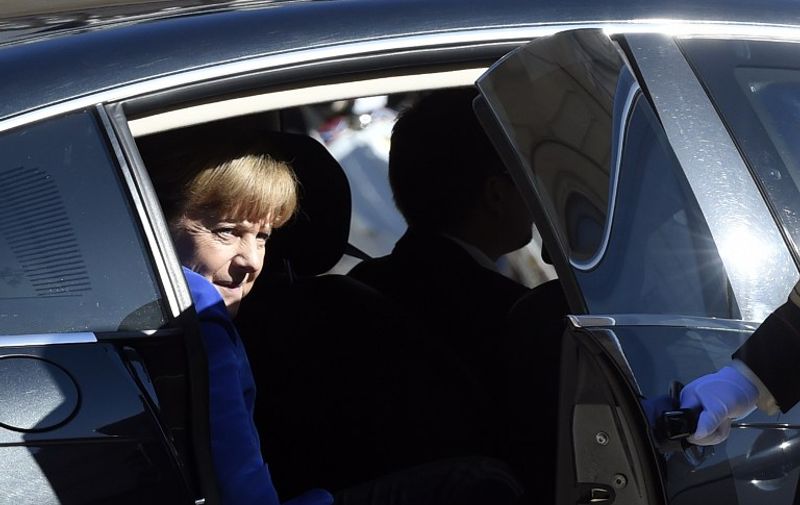 German Chancellor Angela Merkel arrives at the Elysee Palace, in Paris, on October 2, 2015, for a peace summit on the Ukraine conflict. The leaders of France, Germany, Russia and Ukraine meet in Paris to consolidate a fragile peace in Ukraine, as a conflict that appears to be winding down is overshadowed by President Vladimir Putin's dramatic intervention in Syria's war. AFP PHOTO / ALAIN JOCARD / AFP PHOTO / ALAIN JOCARD