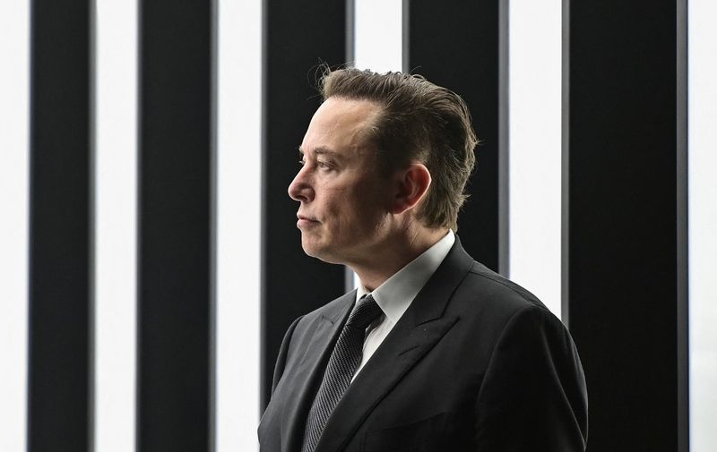(FILES) In this file photo taken on March 22, 2022, Tesla CEO Elon Musk is pictured as he attends the start of the production at Tesla's "Gigafactory" in Gruenheide, southeast of Berlin. - Twitter plans to hold a meeting for employees concerned about Tesla Chief Executive Elon Musk's influence on the company's board, a Twitter spokesperson said April 8, 2022. (Photo by Patrick Pleul / POOL / AFP)
