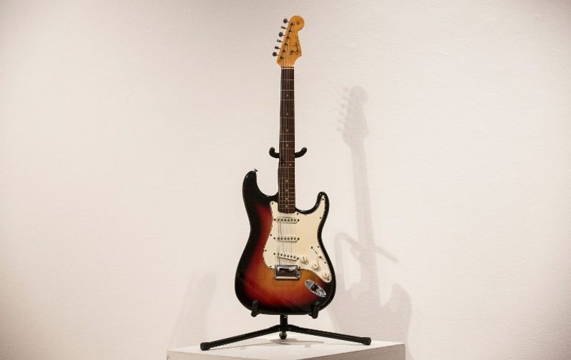 NEW YORK, NY - NOVEMBER 25: The Fender Stratocaster electric guitar played by musician Bob Dylan on July 25, 1965 at Newport Folk Festival, better known as "the night Dyan went electric" is seen at an auction preview at Christie's on November 25, 2013 in New York City. The guitar is estimated at $300,000 to $500,000.   Andrew Burton/Getty Images/AFP