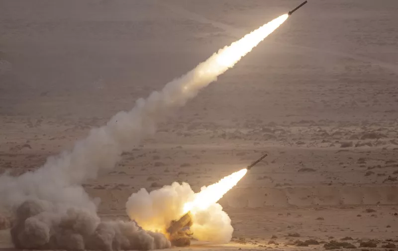 A US M142 High Mobility Artillery Rocket System (HIMARS) fires salvoes during the second annual "African Lion" military exercise in the Tan-Tan region in southwestern Morocco on June 30, 2022. (Photo by FADEL SENNA / AFP)