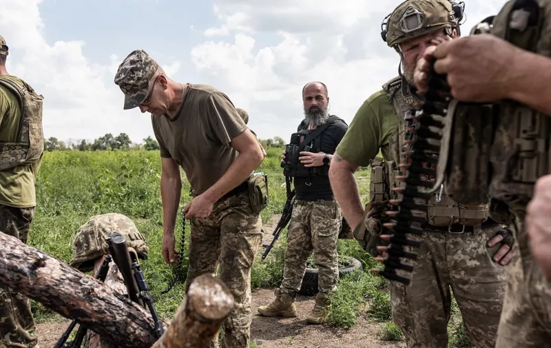 DONETSK OBLAST, UKRAINE - AUGUST 18: Ukrainian soldiers prepare bullets for a machine gun during training as the Russia-Ukraine war continues in Donetsk Oblast, Ukraine on August 18, 2023. Diego Herrera Carcedo / Anadolu Agency (Photo by Diego Herrera Carcedo / ANADOLU AGENCY / Anadolu Agency via AFP)