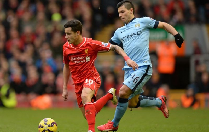 Manchester City's Argentinian striker Sergio Aguero (R) vies with Liverpool's Brazilian midfielder Philippe Coutinho during the English Premier League football match between Liverpool and Manchester City at Anfield stadium in Liverpool, north west England, on March 1, 2015. AFP PHOTO / OLI SCARFF

RESTRICTED TO EDITORIAL USE. NO USE WITH UNAUTHORIZED AUDIO, VIDEO, DATA, FIXTURE LISTS, CLUB/LEAGUE LOGOS OR "LIVE" SERVICES. ONLINE IN-MATCH USE LIMITED TO 45 IMAGES, NO VIDEO EMULATION. NO USE IN BETTING, GAMES OR SINGLE CLUB/LEAGUE/PLAYER PUBLICATIONS. / AFP / OLI SCARFF