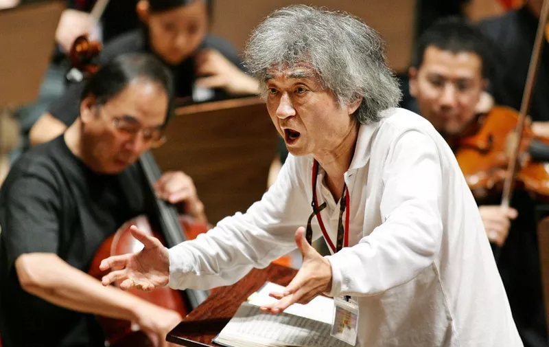(FILES) This file photo taken on July 19, 2006 shows Japanese conductor Seiji Ozawa conducting a performance of Mahler's Symphony No. 2 ''Resurrection'' during a rehearsal at the Aichi Prefectural Theater in Nagoya, central Japan. Media reports said on February 9, 2024 that Japanese star conductor Seiji Ozawa has died at the age of 88. (Photo by JIJI PRESS / AFP) / Japan OUT