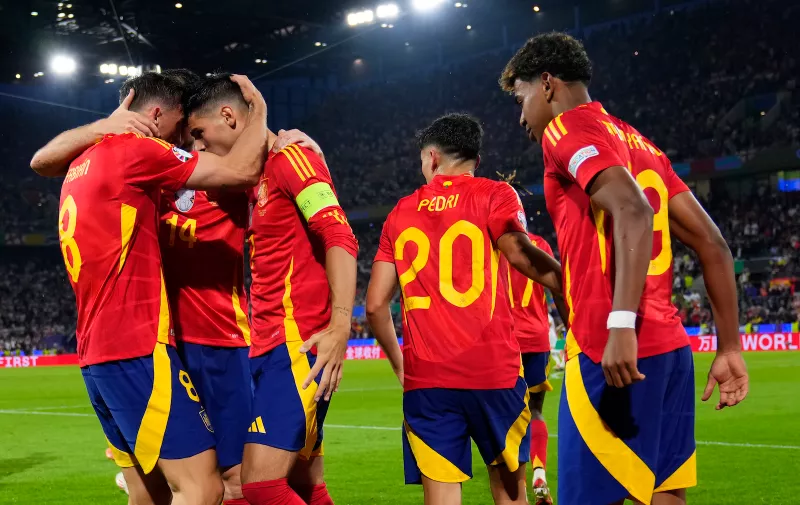 Spain's Fabian Ruiz celebrates with teammates after scoring his sides second goal during a round of sixteen match between Spain and Georgia at the Euro 2024 soccer tournament in Cologne, Germany, Sunday, June 30, 2024. (AP Photo/Manu Fernandez)