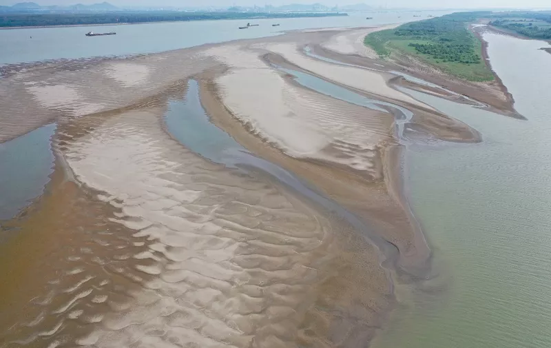 This aerial photo taken on September 4, 2022 shows a section of a parched river bed along the Yangtze River in Ma'anshan in China's eastern Anhui province. (Photo by AFP) / China OUT