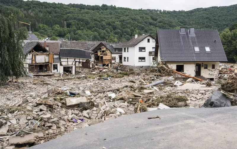 Partial view of debris and damaged houses destroyed by the floods in Schuld near Bad Neuenahr, western Germany, on July 15, 2021. - Heavy rains and floods lashing western Europe have killed at least 20 people in Germany and left around 50 missing, as rising waters led several houses to collapse. (Photo by Bernd Lauter / AFP)