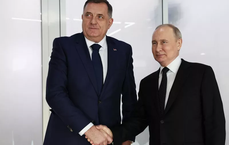 In this pool photograph distributed by Russian state agency Sputnik, Russia's President Vladimir Putin meets with President of the Republika Srpska, Milorad Dodik, in Kazan on February 21, 2024. (Photo by Sergei BOBYLYOV / POOL / AFP)