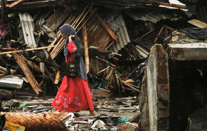 BANTEN, INDONESIA - DECEMBER 27 : A Woman searching something at her house after the tsunami hit at Sumur village in Pandeglang regency, Banten Province, Indonesia.
A tsunami struck Indonesia’s Sunda Strait, the expanse between the islands of Java and Sumatra, on the night of December 22, local time.According to initial news reports, it appears that an underwater landslide was triggered by volcanic activity at the site of the infamous Krakatoa volcano – specifically, Anak Krakatau, the frequently erupting baby volcano growing in the annihilated heart of the older, larger edifice. This landslide pushed away plenty of water, and a tsunami was generated.
Photo by Ichalhem / Sijori Images, Image: 404318330, License: Rights-managed, Restrictions: , Model Release: no, Credit line: Profimedia, Barcroft Media
