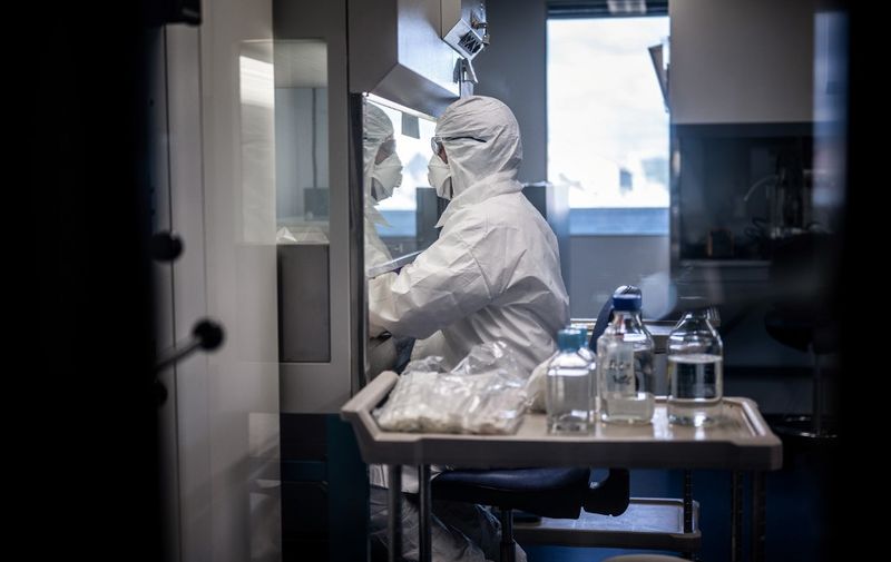 A scientist is at work in the VirPath university laboratory, classified as "P3" level of safety, on February 5, 2020 as they try to find an effective treatment against the new SARS-like coronavirus, which has already caused more than 560 deaths. - When most are busy developing vaccines or testing the few anti-virals available, VirPath will go after drugs used for diseases that have nothing to do with a respiratory infection such as 2019-nCoV. (Photo by JEFF PACHOUD / AFP)