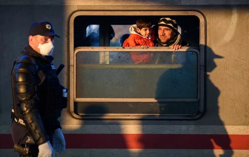 Migrants and refugees arrive on a train after crossing the Croatian-Slovenian border on October 30, 2015 in Dobova. Austria's interior minister on October 29 reiterated the need for some kind of "barrier" at its Slovenian border to control the record migrant influx, but eased off her call for an actual fence. AFP PHOTO / JURE MAKOVEC (Photo by Jure Makovec / AFP)