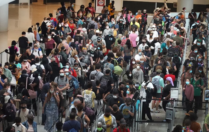 NEW ORLEANS, LOUISIANA - AUGUST 28: People stand in line to get through the TSA security checkpoint at Louis Armstrong New Orleans International Airport on August 28, 2021 in New Orleans, Louisiana. Residents were evacuating the area as Hurricane Ida worked its way toward the Louisiana coastline with an expected landfall on Sunday afternoon .   Scott Olson/Getty Images/AFP (Photo by SCOTT OLSON / GETTY IMAGES NORTH AMERICA / Getty Images via AFP)