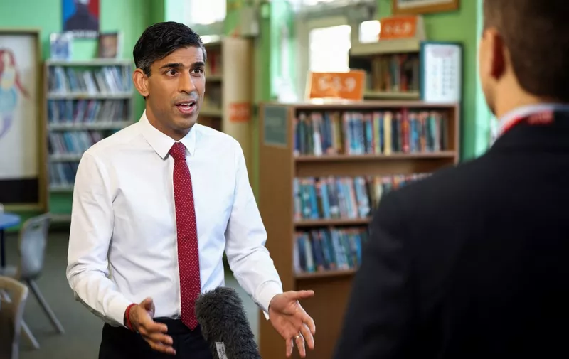 Britain's Prime Minister Rishi Sunak speaks during a televion media interview during his visit to Harris Academy secondary school in south west London on January 6, 2023. (Photo by HENRY NICHOLLS / POOL / AFP)