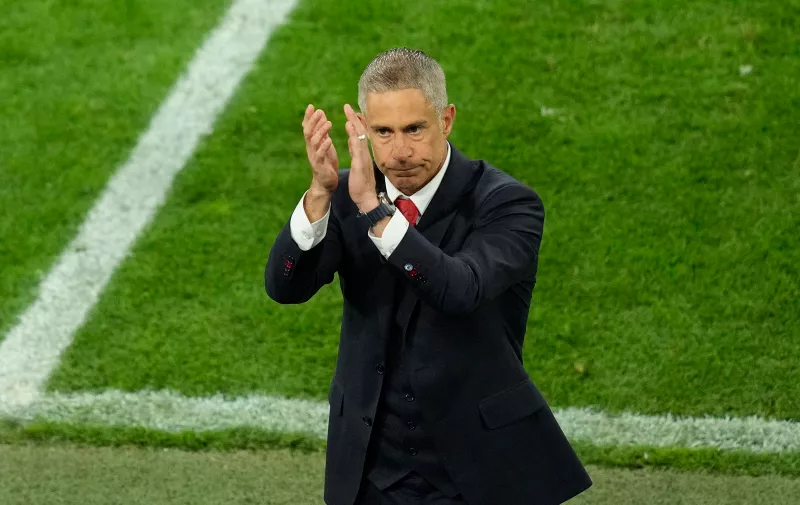 Albania's head coach Sylvinho applauds supporters at the end of a Group B match between Italy and Albania at the Euro 2024 soccer tournament in Dortmund, Germany, Saturday, June 15, 2024. (AP Photo/Andreea Alexandru)