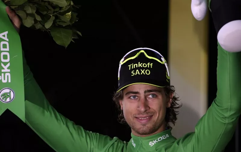 Slovakia's Peter Sagan celebrates his green jersey of best sprinter on the podium at the end of the 138 km nineteenth stage of the 102nd edition of the Tour de France cycling race on July 24, 2015, between Saint-Jean-de-Maurienne and La Toussuire, French Alps. AFP PHOTO / KENZO TRIBOUILLARD
